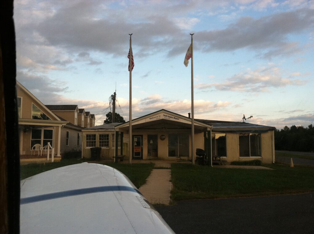 A view of Cecil County Airport's FBO from the Ercoupe's cockpit.